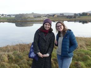 Visitors on tour with Clickimin Broch in background